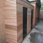 Cedarwood garden store room with black plywood cladding and cedarwood battens in Ham, Richmond