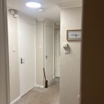 Freshly painted hallway with clean white woodwork