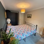 Bedroom painted in Farrow & Ball Skimming Stone and No 289