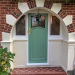 New tiled steps and oak front door painted sage green in Twickenham